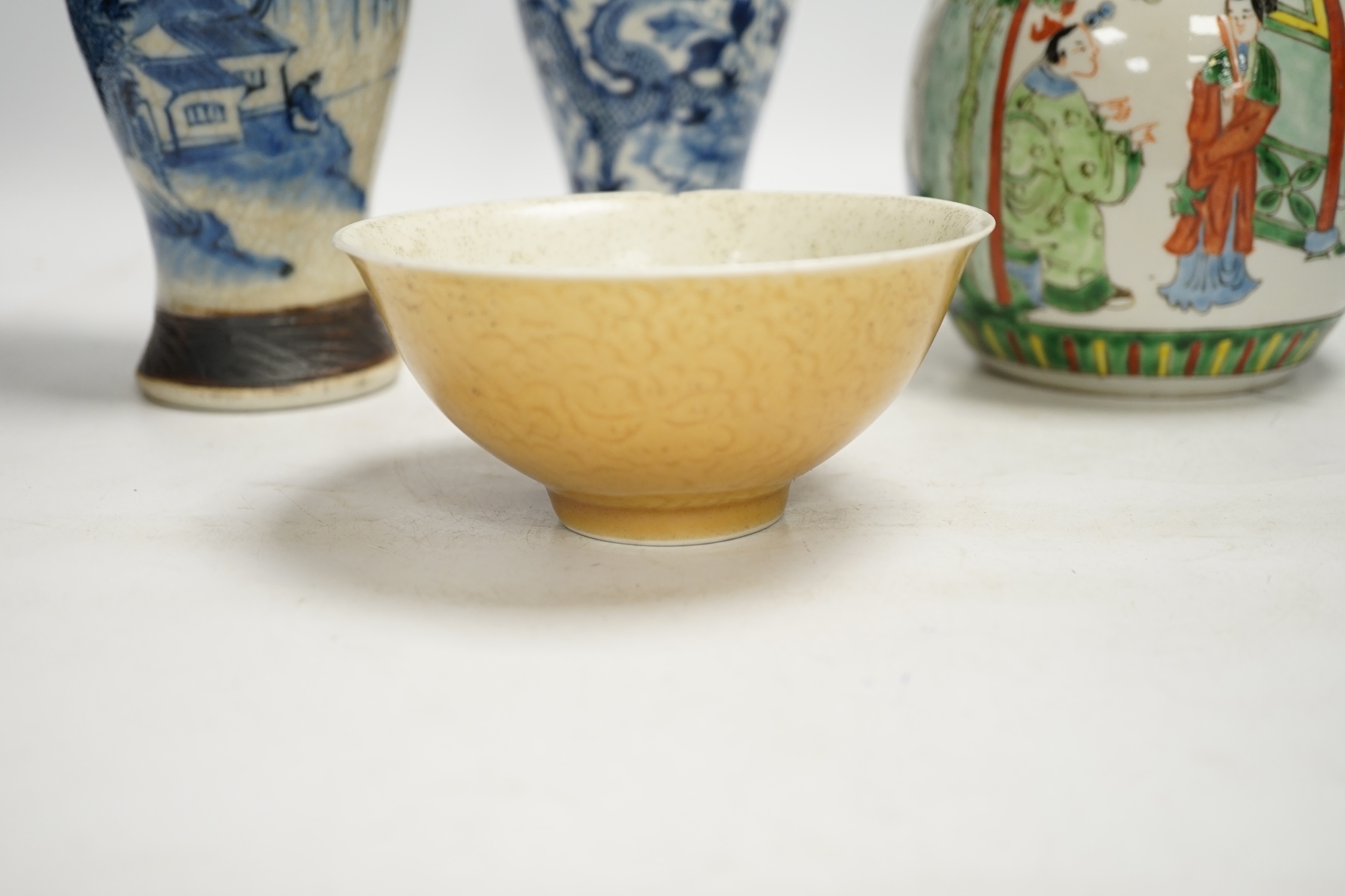 Chinese ceramics to include a crackleware vase and a blue and white vase, a jar and cover and a rice bowl, tallest 20cm high. Condition - all items damaged, overall poor